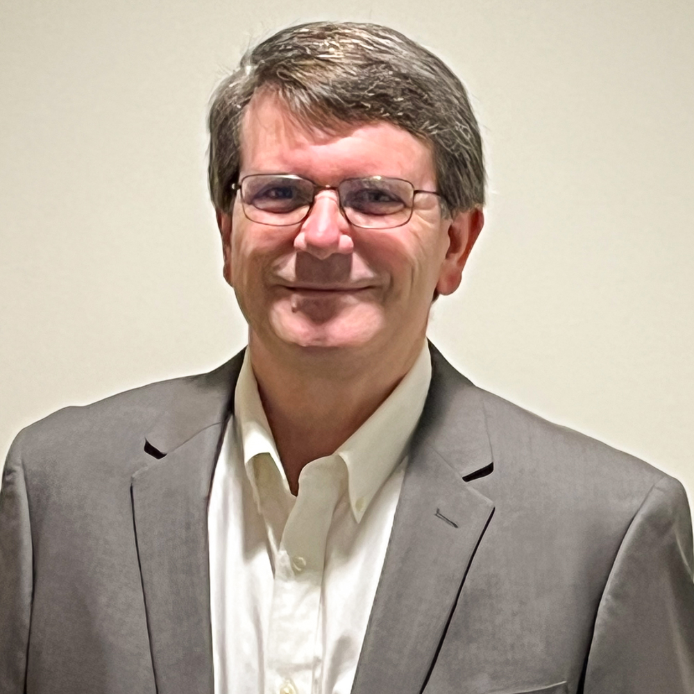 Photo of Doug Brown in gray suit