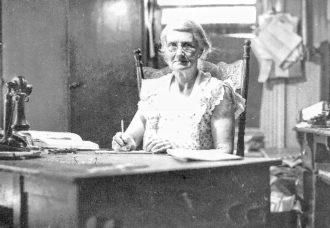 woman sitting at desk working