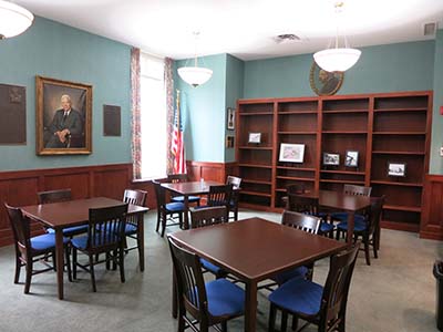 Room with square tables and chairs