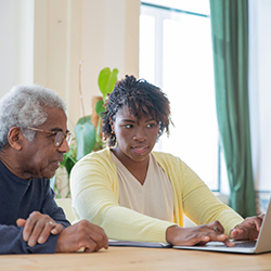 Man and woman using computer